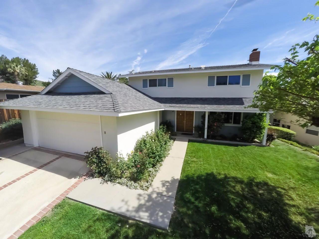 5414 Parkmor Road Calabasas, CA 91302 - Photo 3 of 58 a front view of a house with a yard and garage