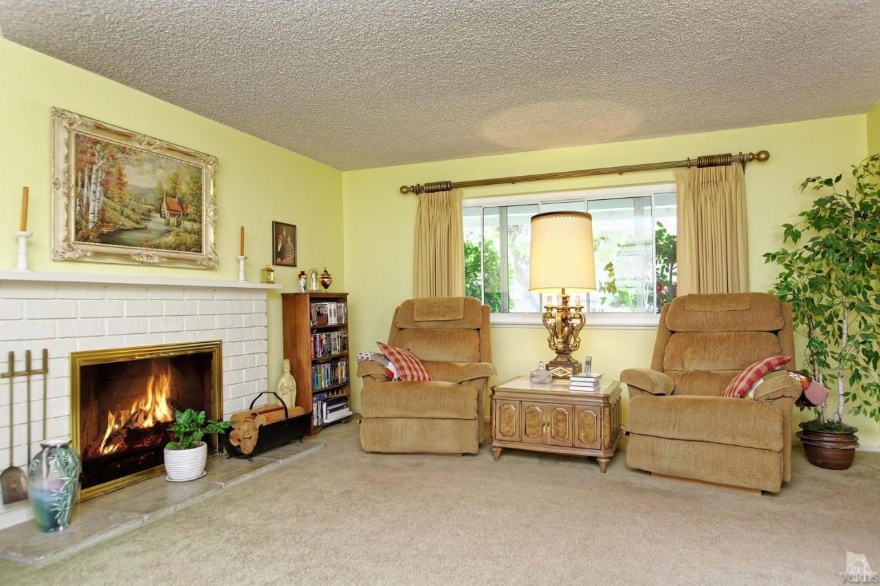 5414 Parkmor Road Calabasas, CA 91302 - Photo 21 of 58 a living room with furniture and a fireplace