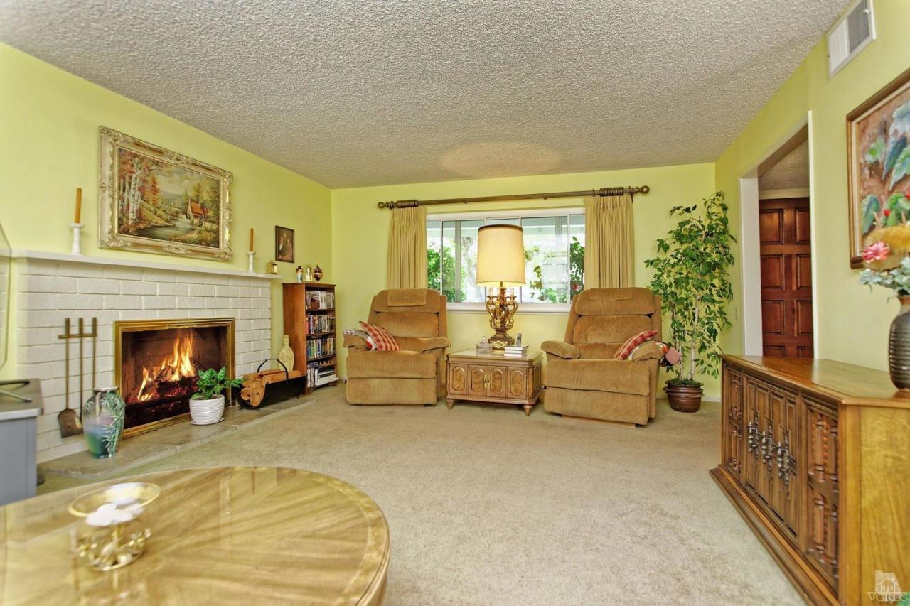 5414 Parkmor Road Calabasas, CA 91302 - Photo 22 of 58 a living room with furniture and a fireplace