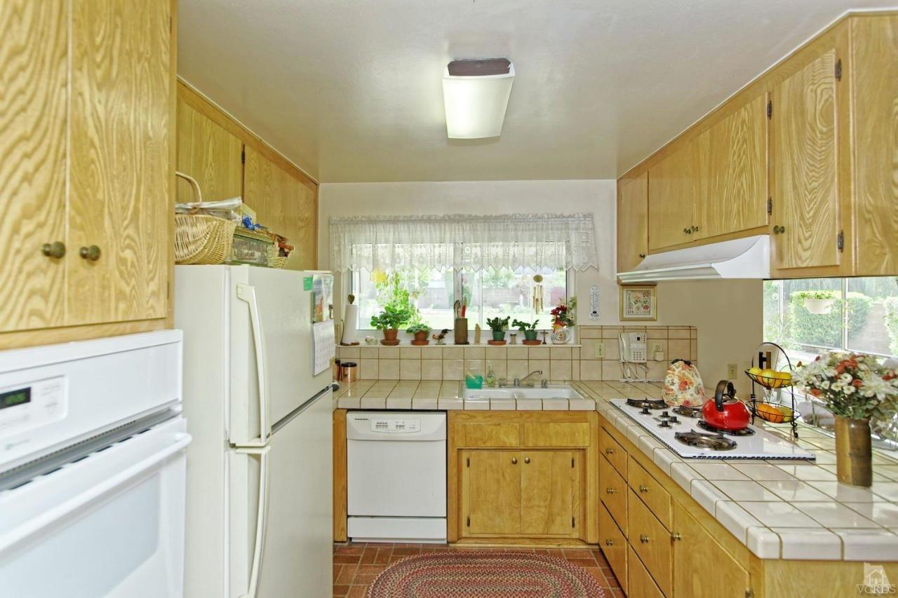 5414 Parkmor Road Calabasas, CA 91302 - Photo 25 of 58 a kitchen with a refrigerator and a sink