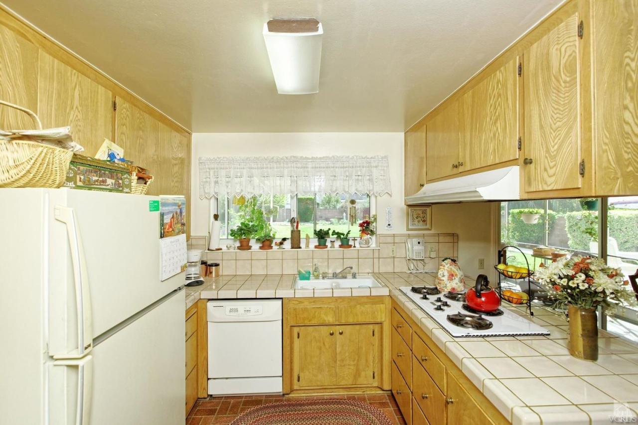 5414 Parkmor Road Calabasas, CA 91302 - Photo 26 of 58 a kitchen with a refrigerator and a sink
