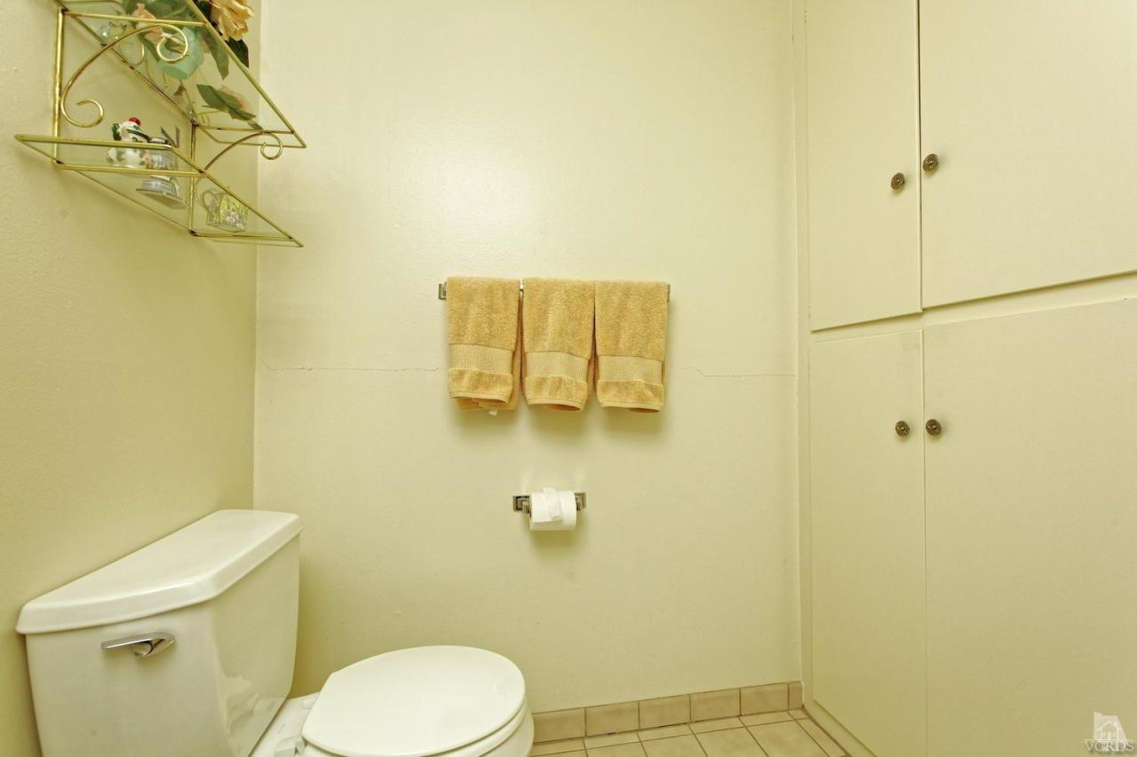 5414 Parkmor Road Calabasas, CA 91302 - Photo 30 of 58 a bathroom with a toilet and a shower