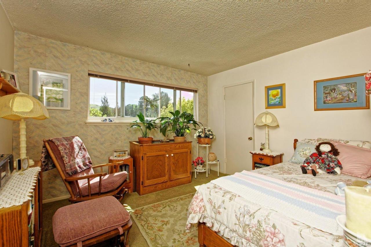 5414 Parkmor Road Calabasas, CA 91302 - Photo 39 of 58 a bedroom with a bed and wooden floor