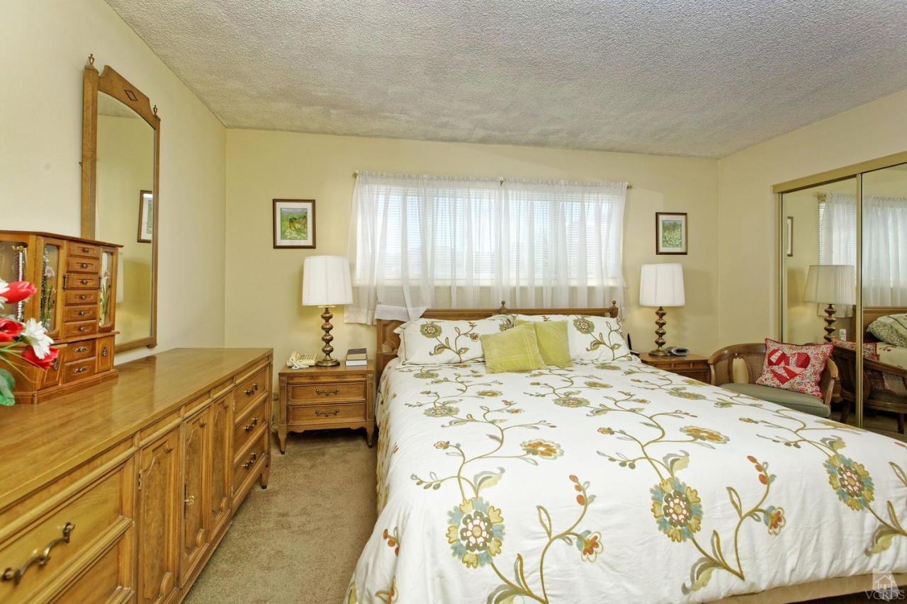 5414 Parkmor Road Calabasas, CA 91302 - Photo 43 of 58 a bedroom with a bed and dresser with mirror
