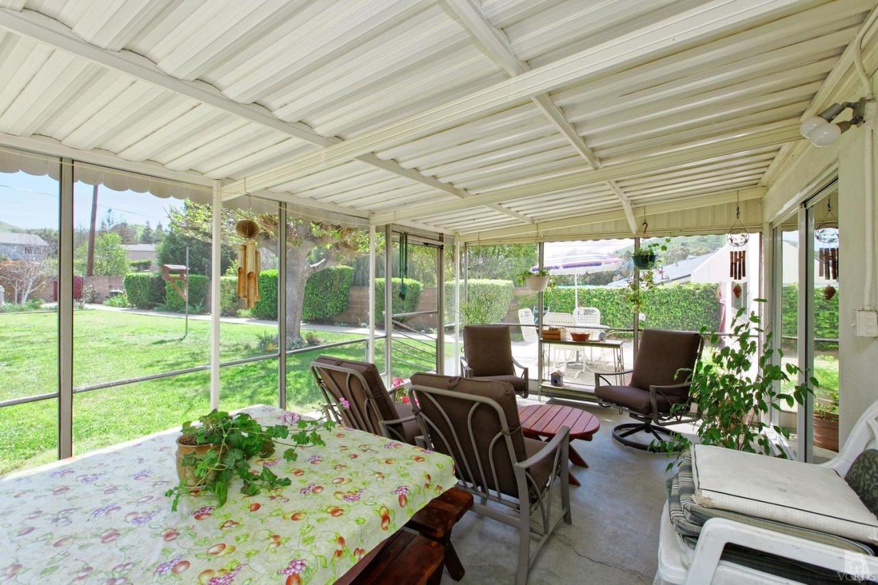 5414 Parkmor Road Calabasas, CA 91302 - Photo 44 of 58 a view of a patio with chairs and floor