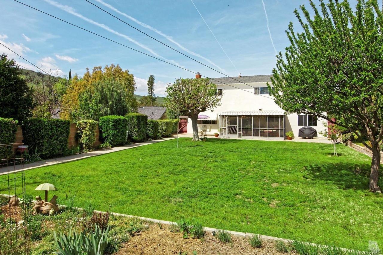 5414 Parkmor Road Calabasas, CA 91302 - Photo 55 of 58 a front view of house with a garden