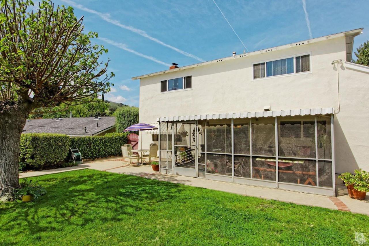 5414 Parkmor Road Calabasas, CA 91302 - Photo 58 of 58 a view of a house with backyard and a garden