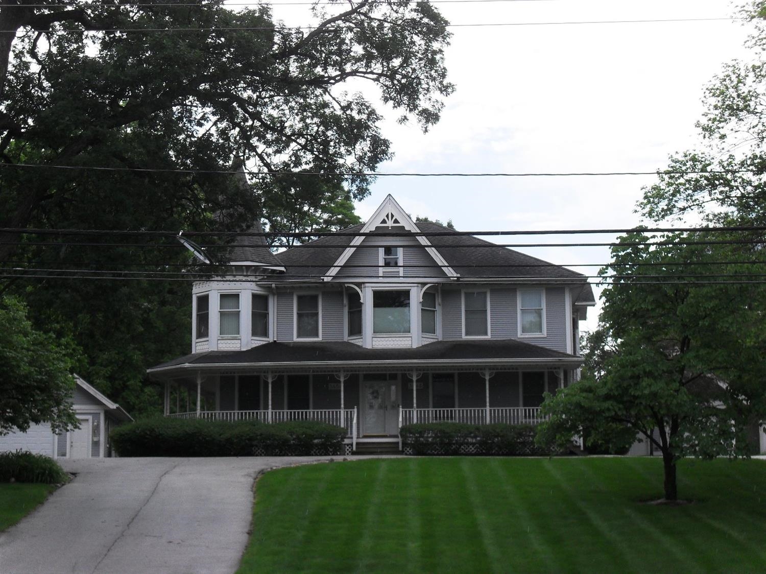 3454 Ridge Road Highland, IN 46322 - Photo 1 of 15 a front view of a house with a garden and trees