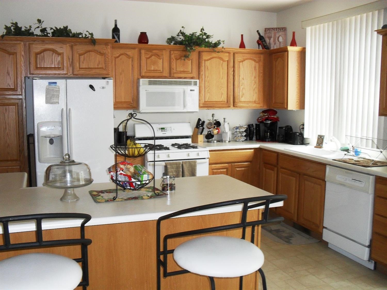 3454 Ridge Road Highland, IN 46322 - Photo 14 of 15 a kitchen with a table chairs stove and cabinets