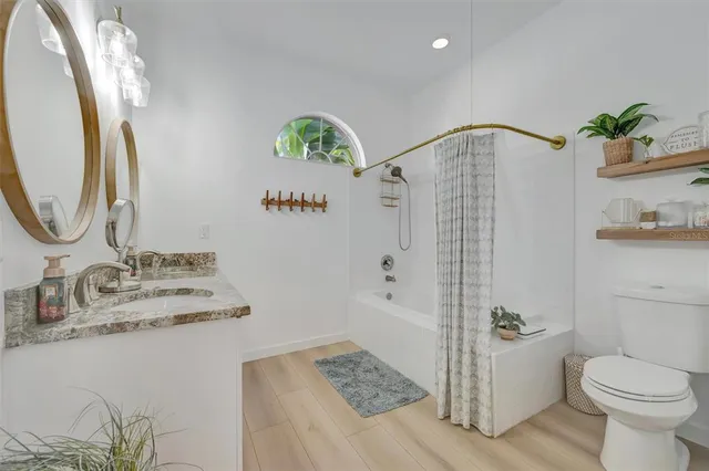 a view of a garden with a building in the background