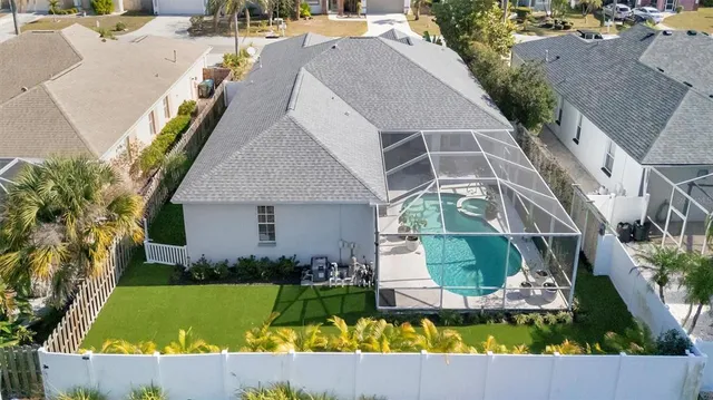 an aerial view of residential houses with city view
