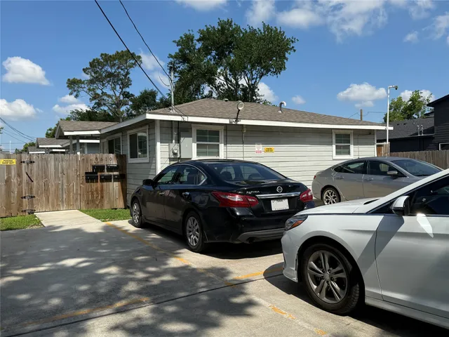 a view of a car parked in front of a house