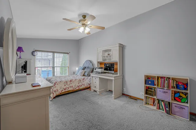 a bedroom with a bed furniture and a window