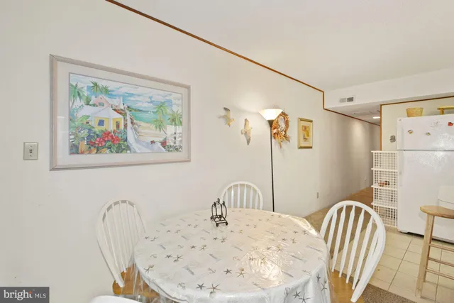 a view of a dining room with furniture and a window