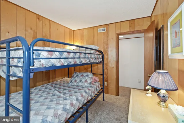 a bedroom with bed and a window