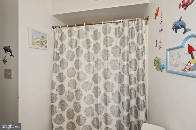 a bathroom with a shower curtain