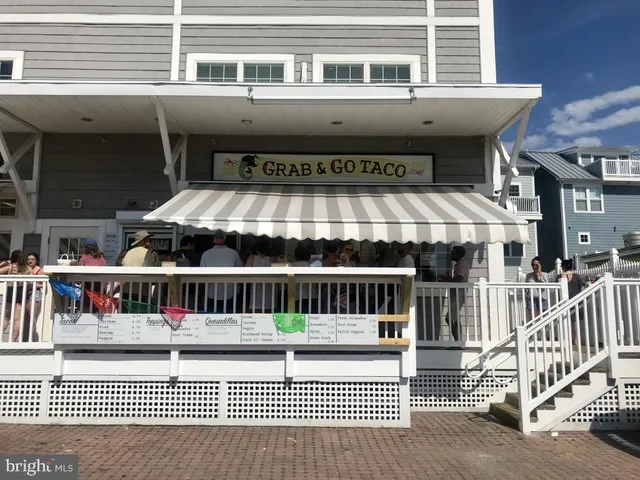 a view of a balcony with large window