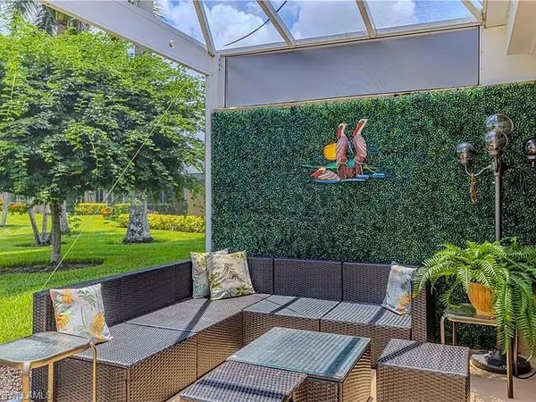 a backyard of a house with outdoor seating