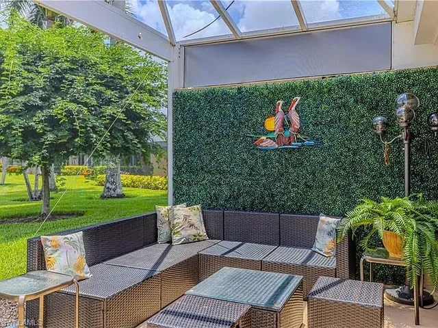 a backyard of a house with outdoor seating