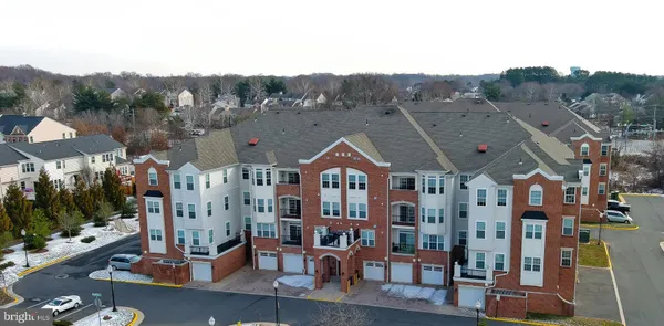 a view of multiple houses with a street