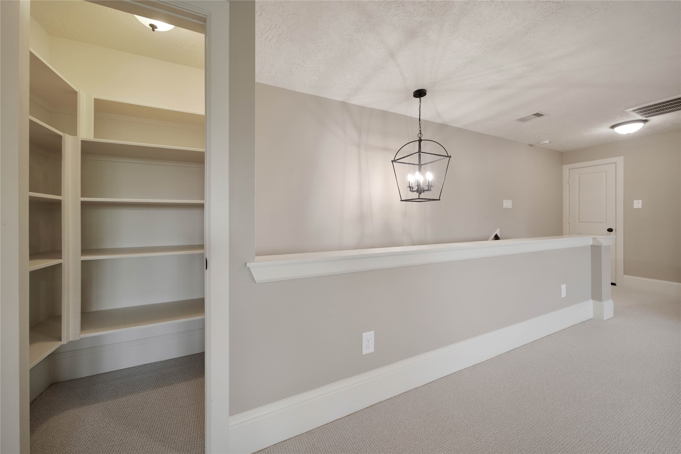 1215 Jake Springs Court Spring, TX 77386 - Photo 29 of 49 The oversized walk-in storage closet up here is delightful and you have access to 2 walk-n attic areas with storage space.
