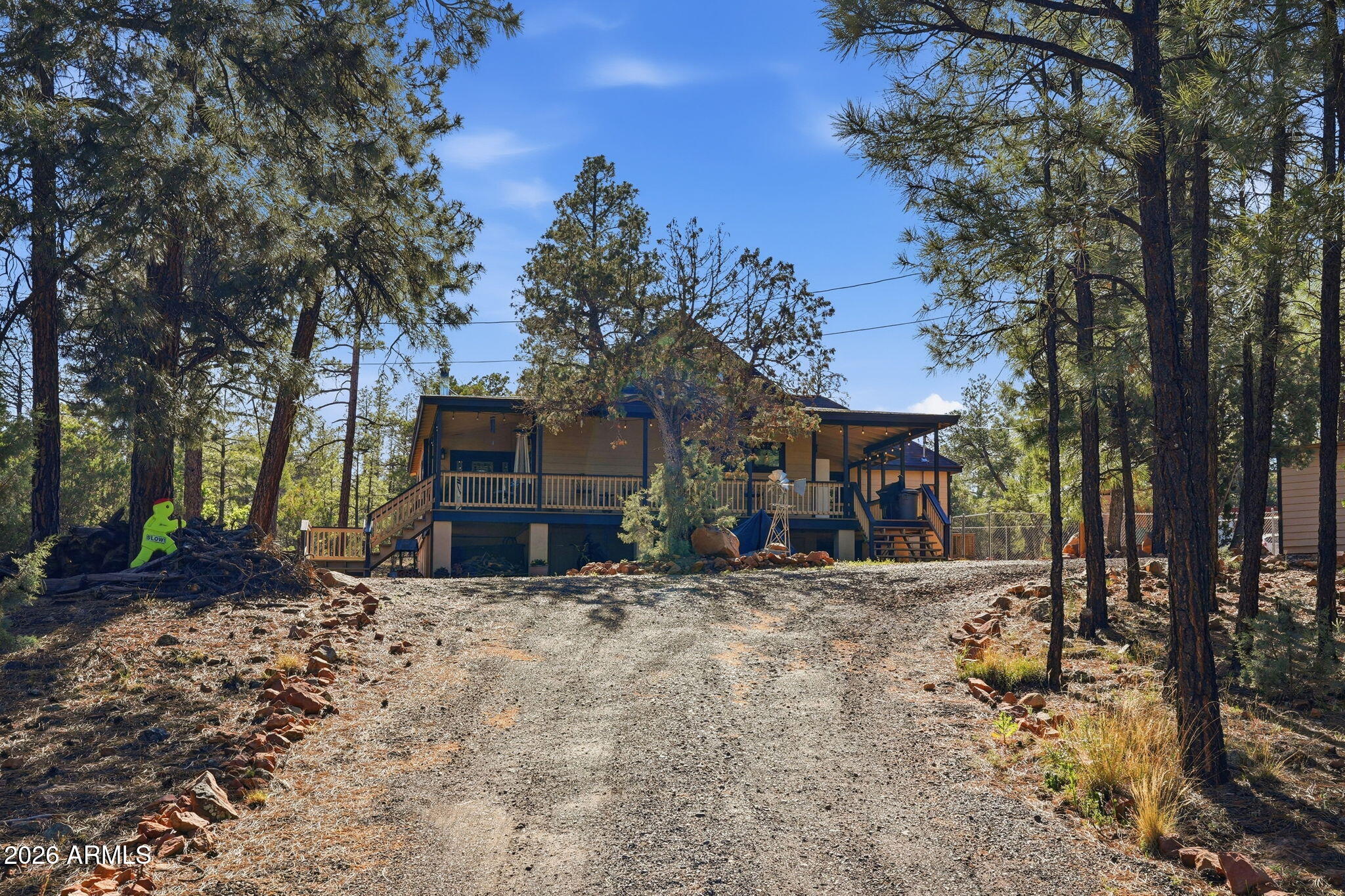 2060 Gilbert Lane Overgaard, AZ 85933 - Photo 11 of 87 a view of a house with trees in the background