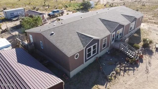 an aerial view of houses with deck