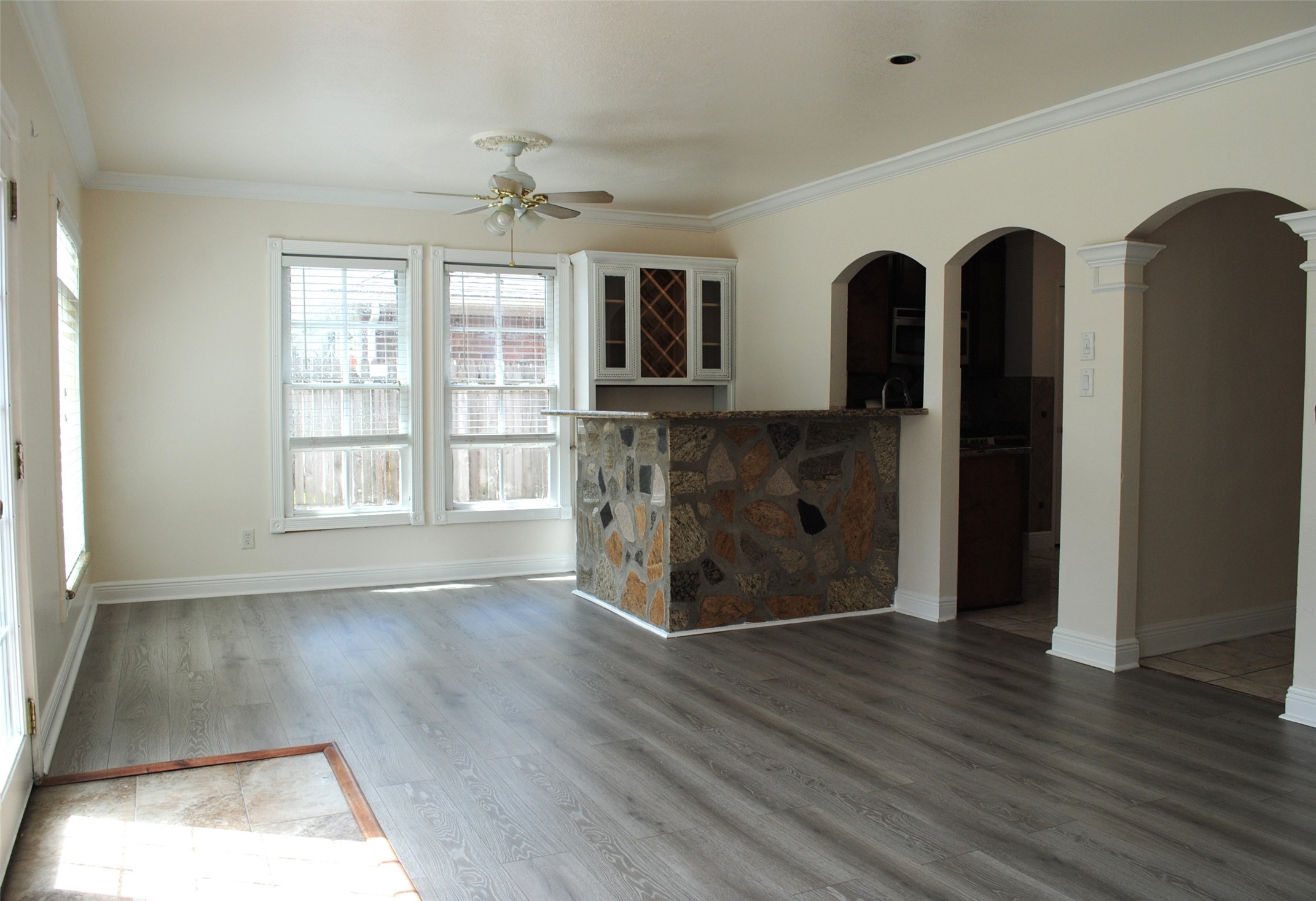 3910 Starbridge Pointe Lane Katy, TX 77449 - Photo 14 of 39 a view of empty room with wooden floor and fan