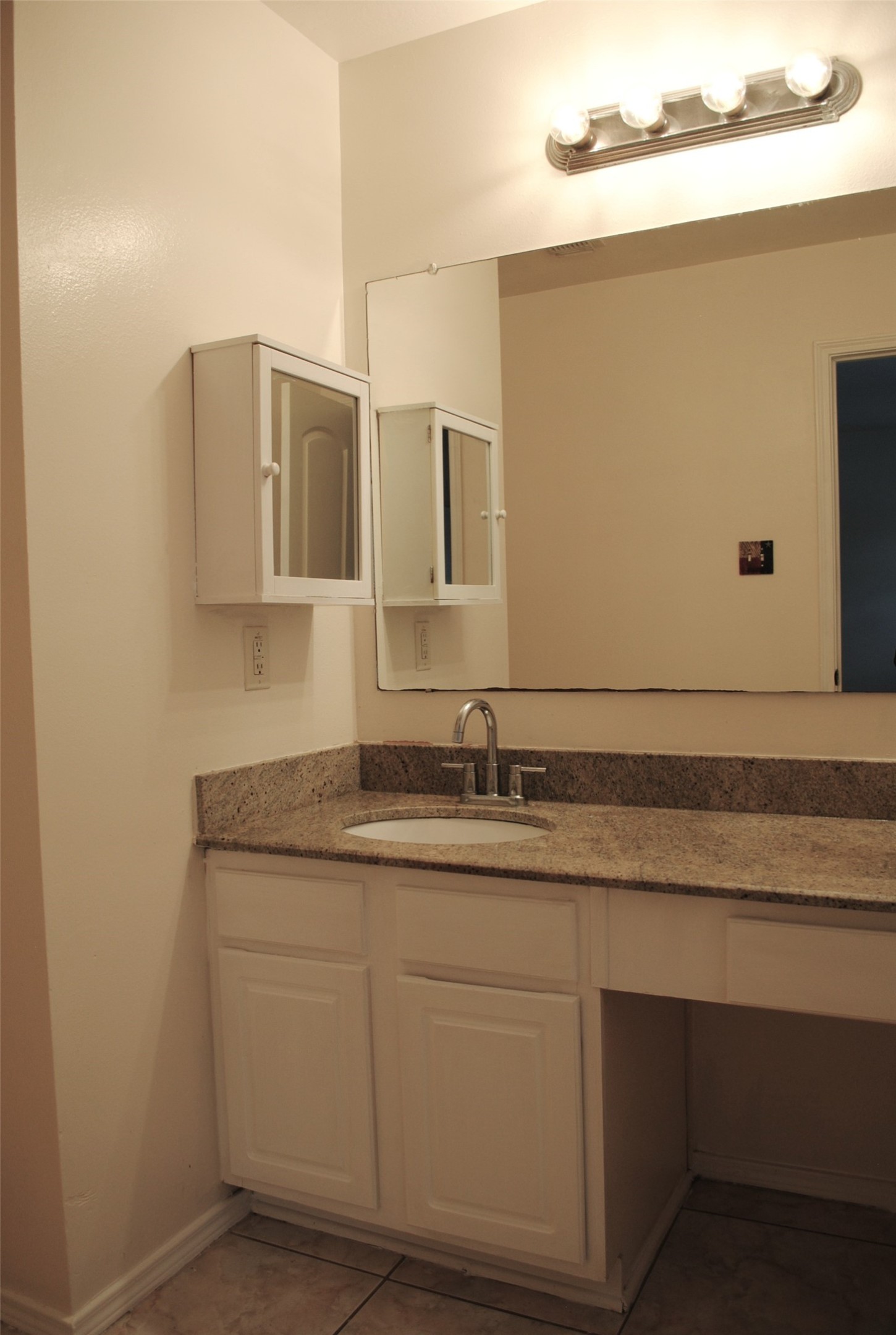 3910 Starbridge Pointe Lane Katy, TX 77449 - Photo 27 of 39 a bathroom with a granite countertop sink and a mirror