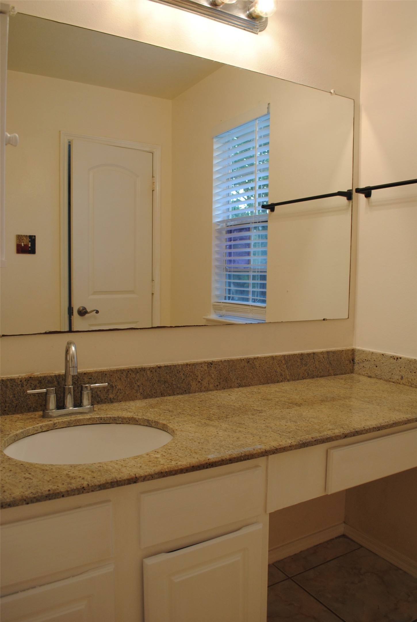 3910 Starbridge Pointe Lane Katy, TX 77449 - Photo 28 of 39 a bathroom with a sink and a mirror