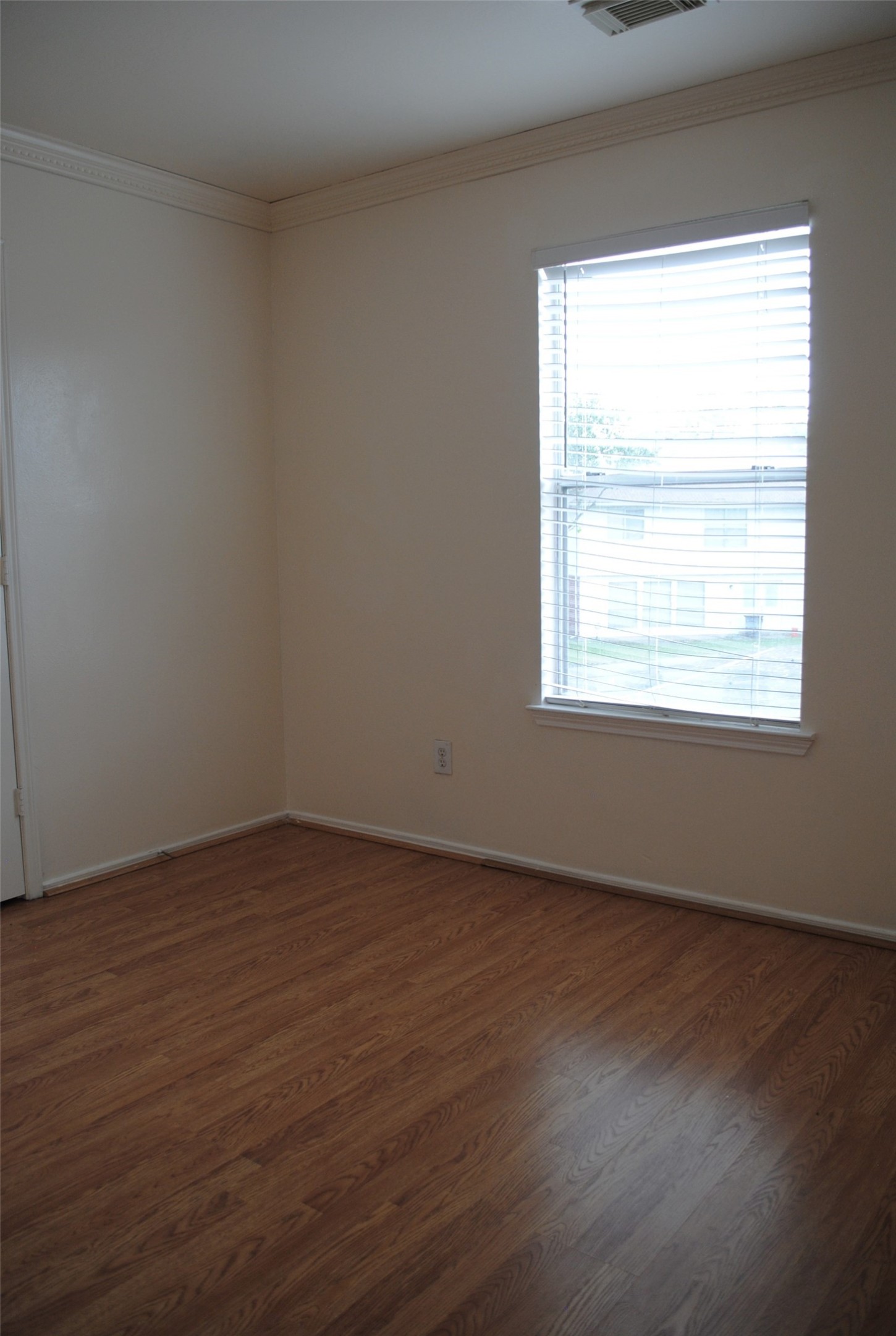 3910 Starbridge Pointe Lane Katy, TX 77449 - Photo 29 of 39 an empty room with wooden floor and windows