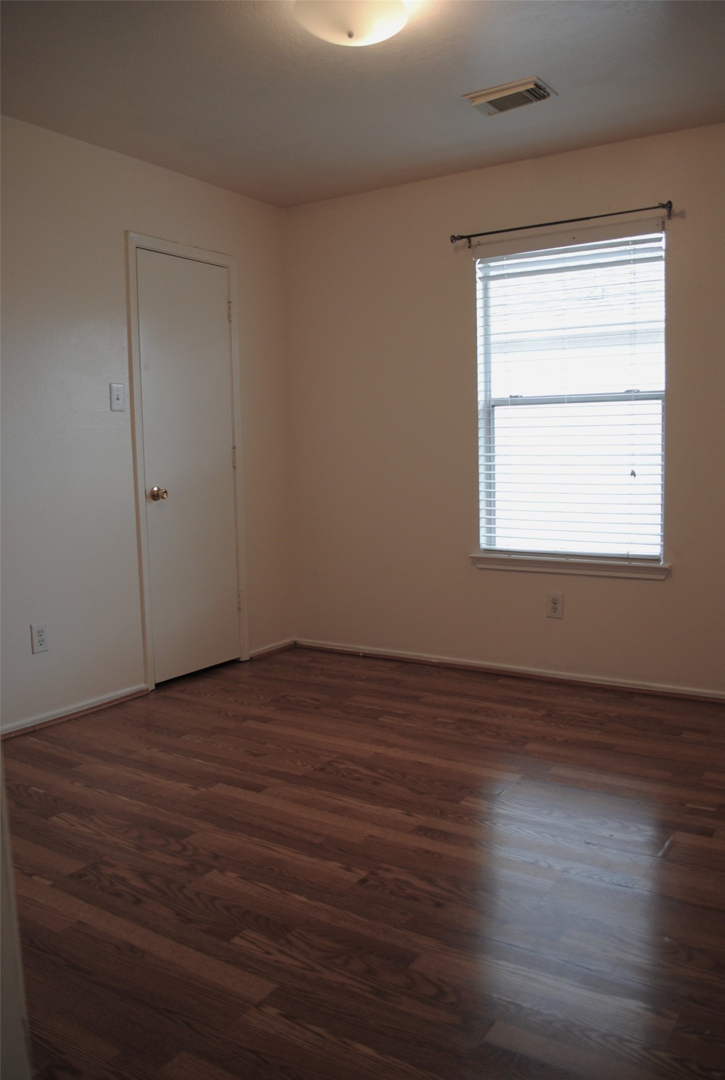 3910 Starbridge Pointe Lane Katy, TX 77449 - Photo 30 of 39 an empty room with wooden floor and windows