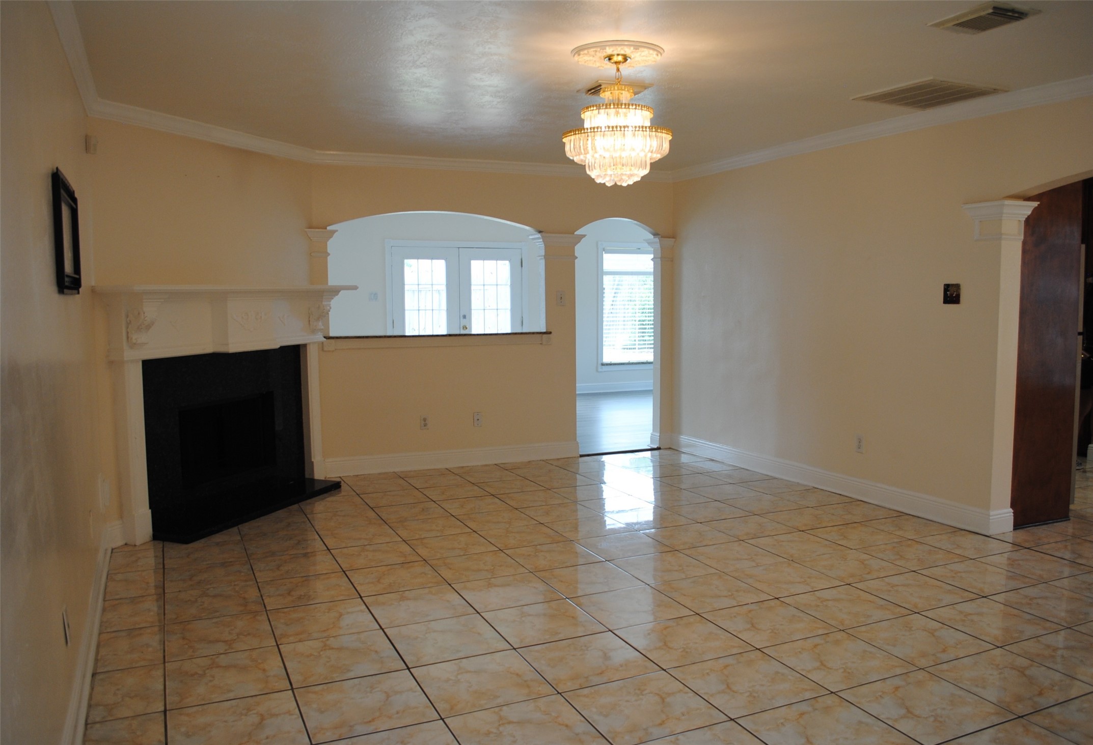 3910 Starbridge Pointe Lane Katy, TX 77449 - Photo 3 of 39 wooden floor in an empty room with a window