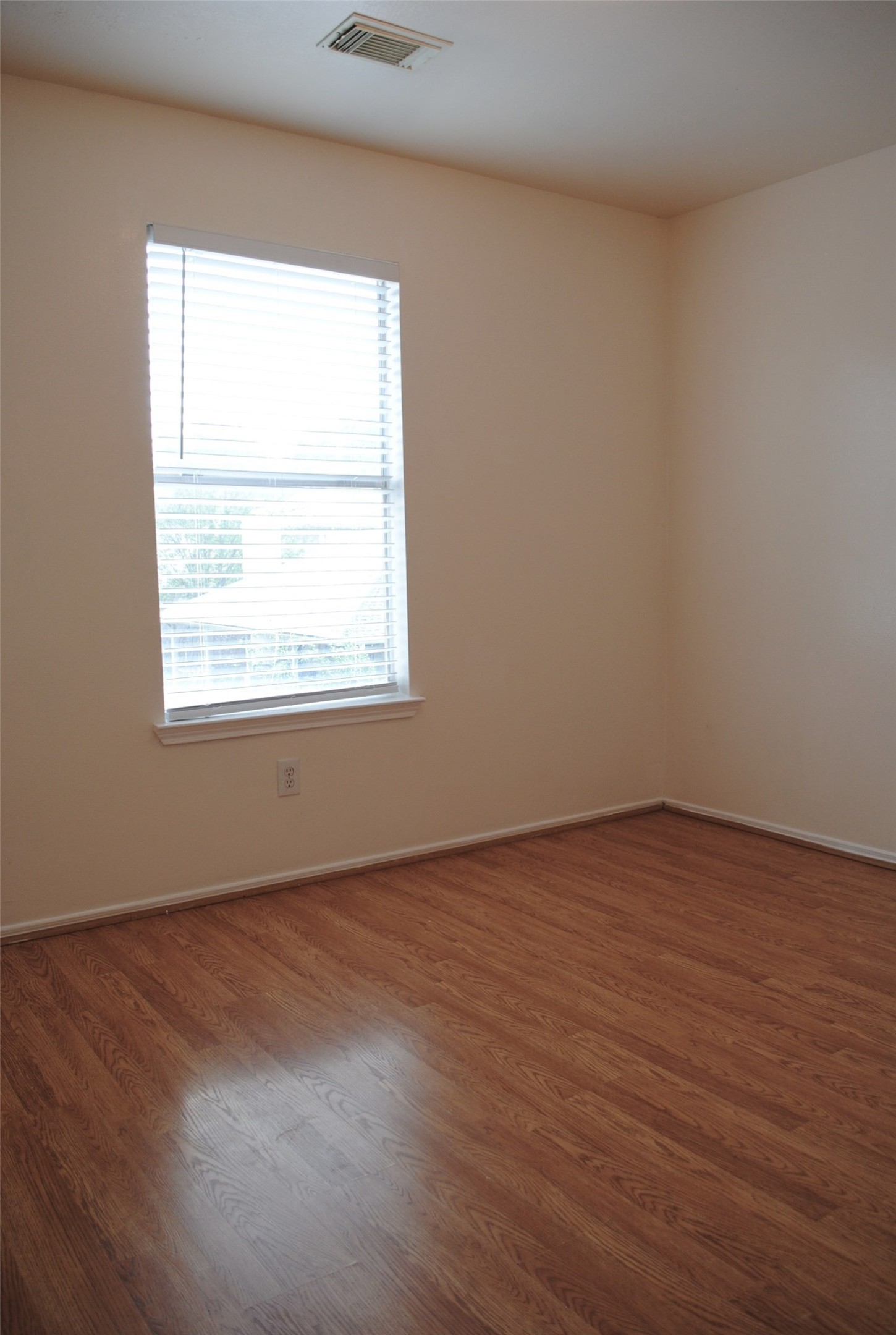 3910 Starbridge Pointe Lane Katy, TX 77449 - Photo 31 of 39 an empty room with wooden floor and a window