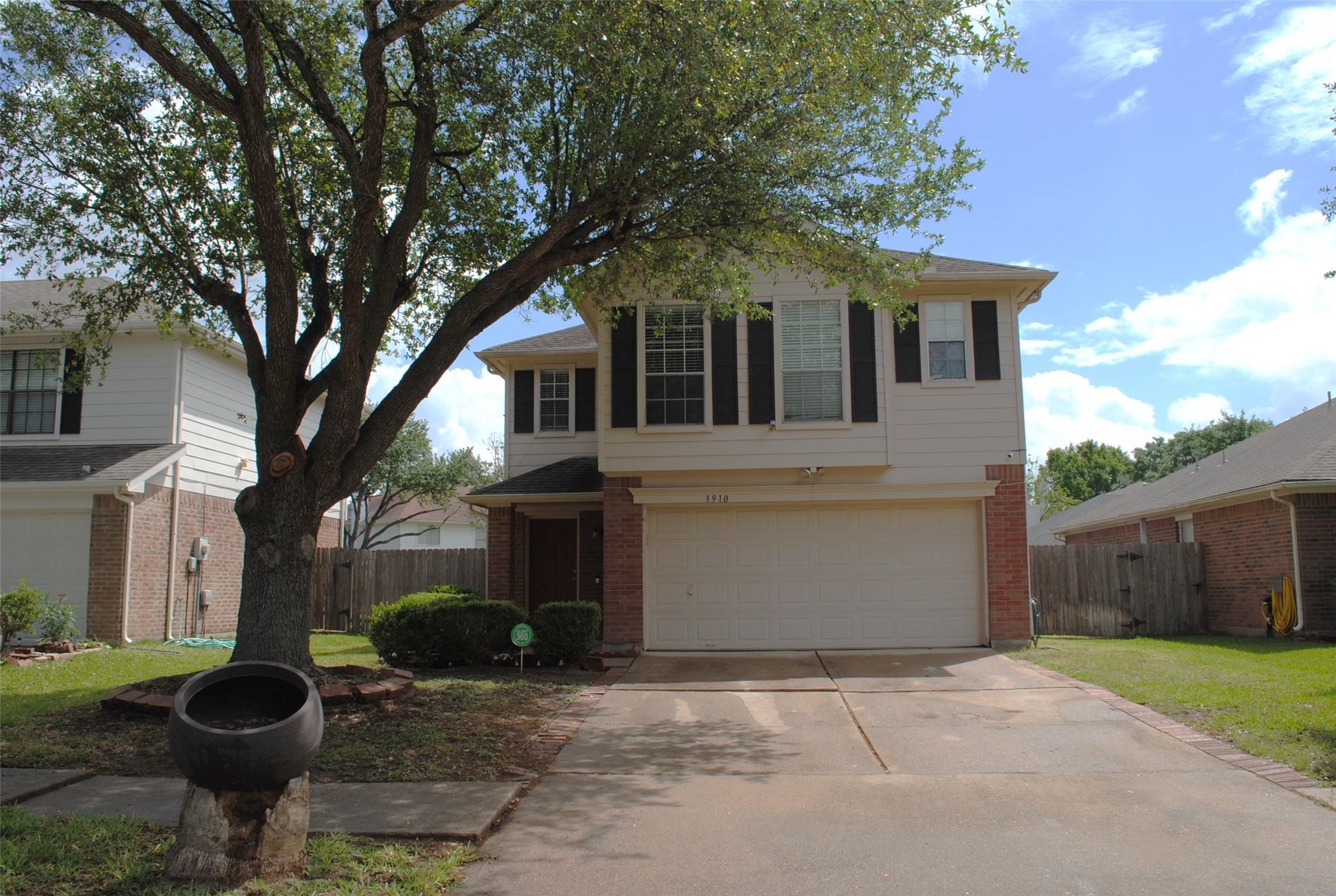3910 Starbridge Pointe Lane Katy, TX 77449 - Photo 39 of 39 a front view of a house with garden and trees