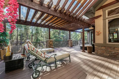 a view of a chairs and table in patio