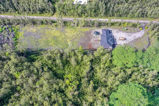 an aerial view of a house with a garden