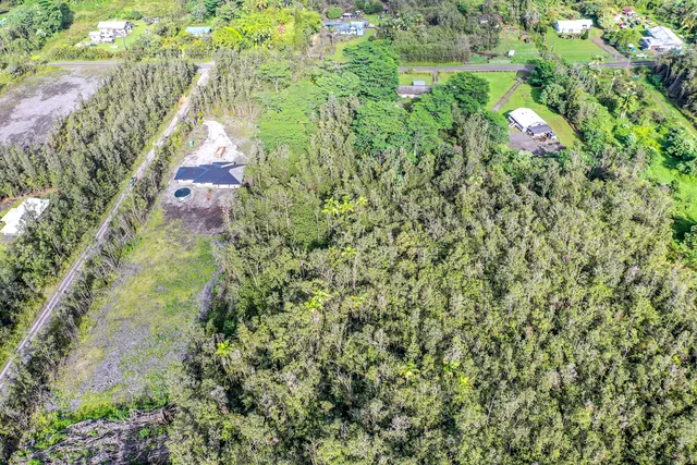 an outdoor view of house with green space
