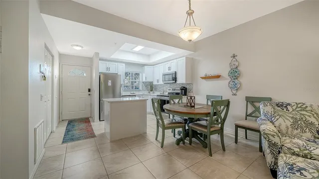 a kitchen with a sink appliances and cabinets
