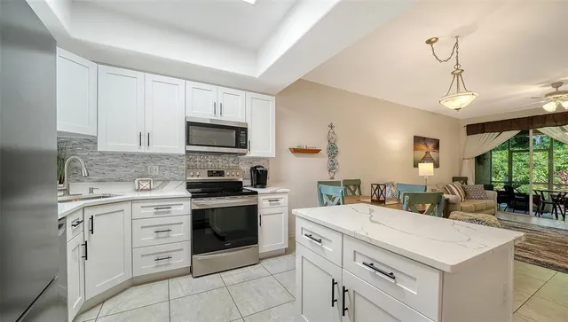 a bedroom with a large bed and a dresser