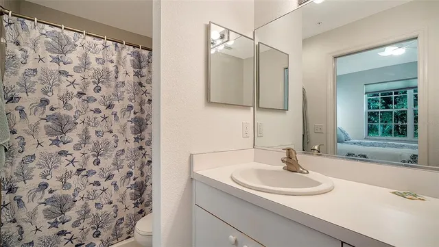 a view of a living room and kitchen