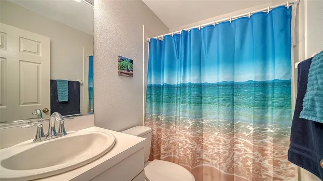 a view of a swimming pool with a patio and a garden