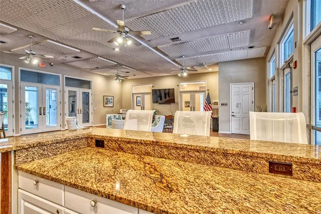 a front view of a house with a yard and outdoor seating