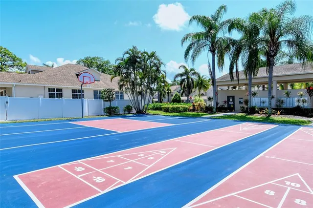 a backyard of a house with barbeque oven fire pit table and chairs