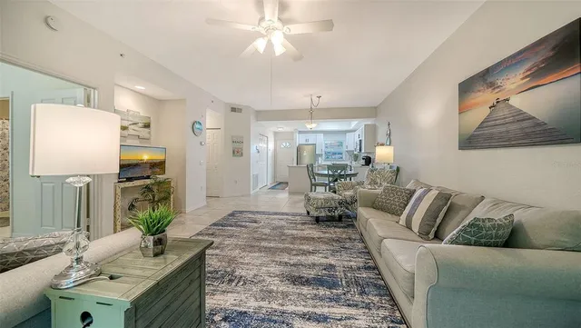 a kitchen with stainless steel appliances granite countertop a refrigerator stove microwave and sink