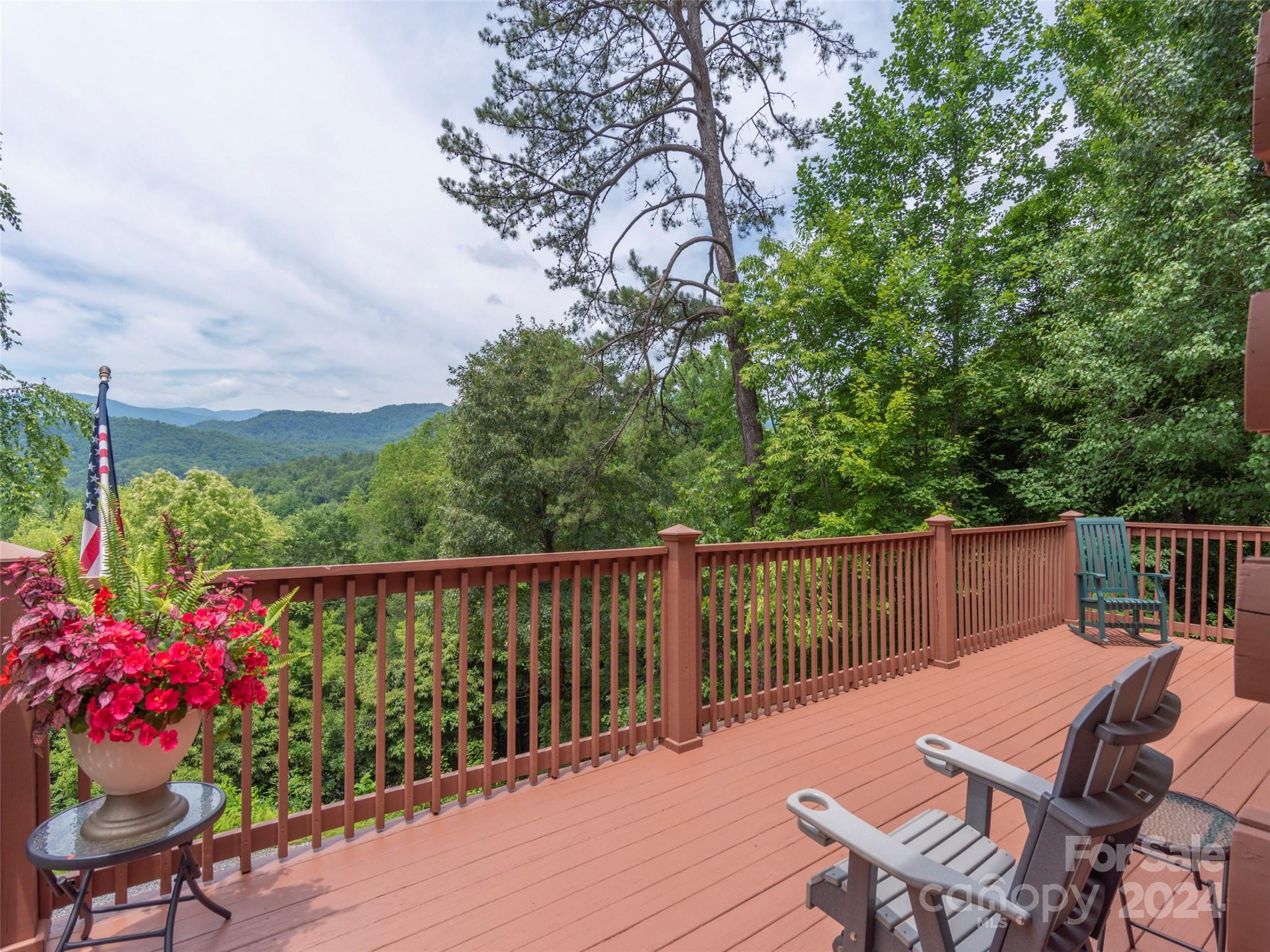 248 Skyview Road Whittier, NC 28789 - Photo 14 of 20 a view of a chairs and table on the terrace