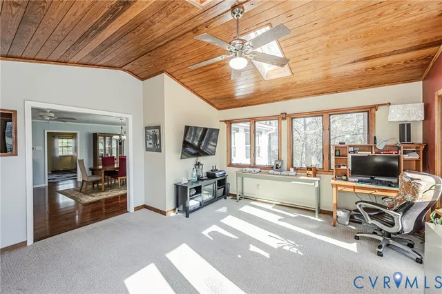 a lobby with furniture and floor to ceiling window