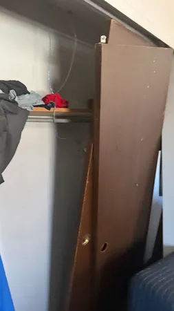 a white toilet sitting next to a bathroom sink and a shower