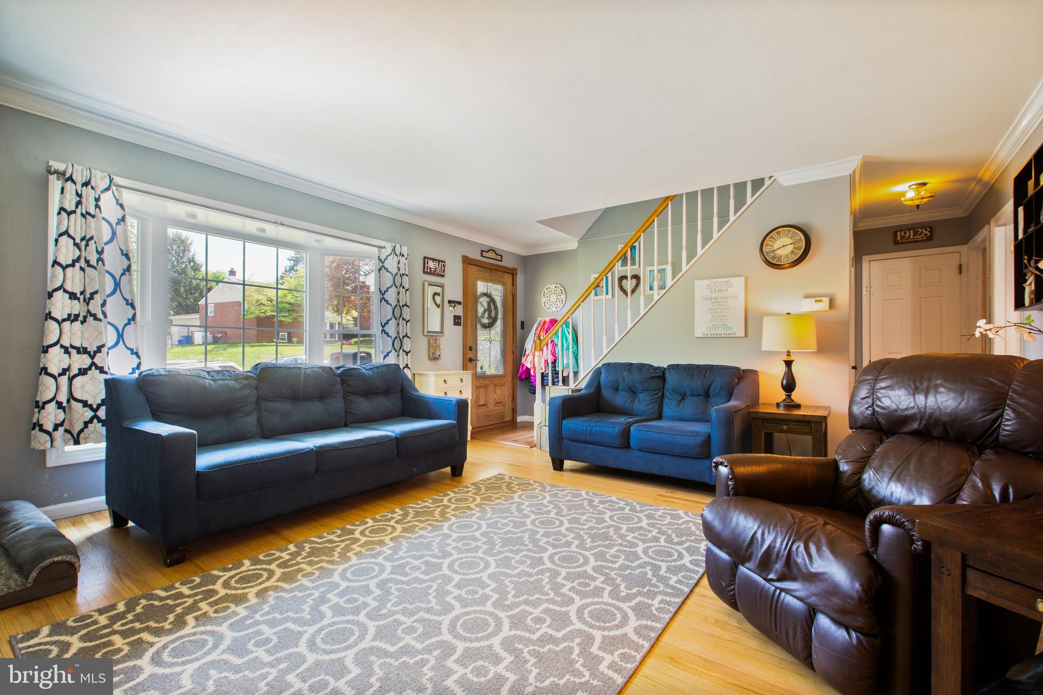 911 Scotia Road Philadelphia, PA 19128 - Photo 5 of 27 a living room with furniture and a large window