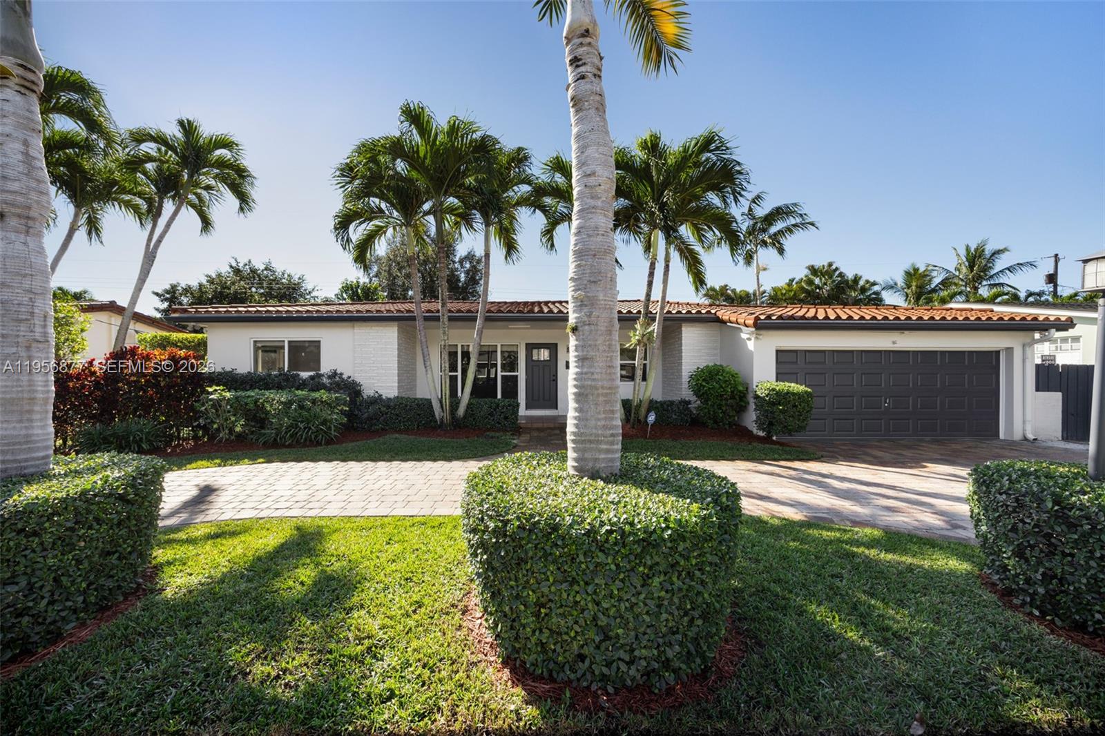 5730 Southwest 56th Terrace Miami, FL 33143 - Photo 1 of 18 front view of a house with a yard